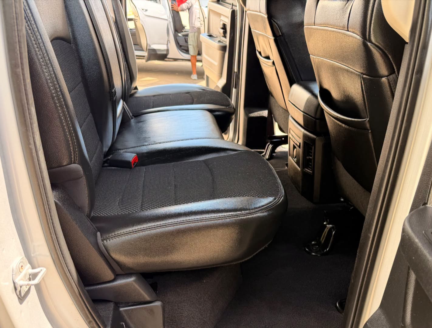 Clean black leather rear seats after interior detailing