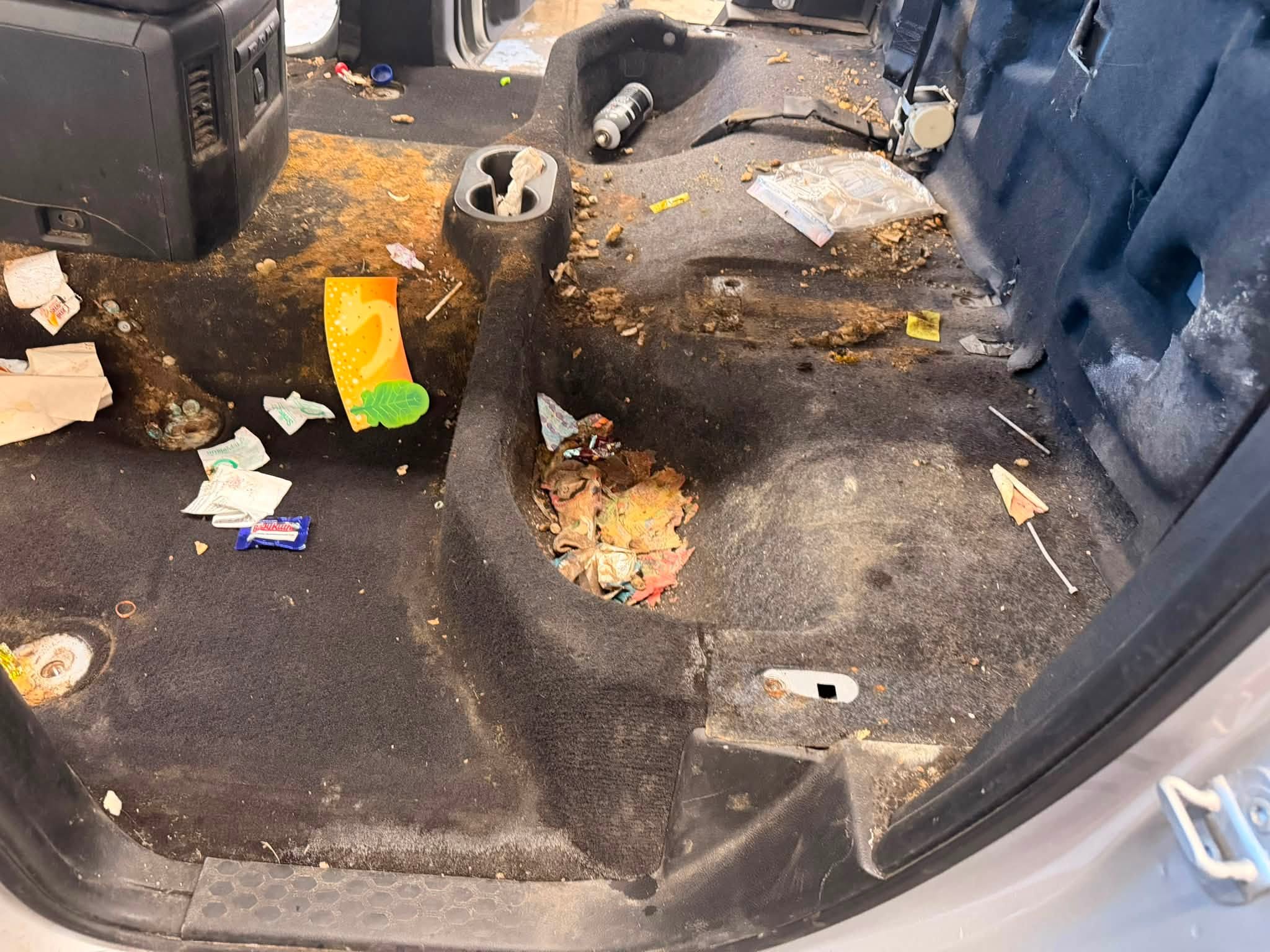 Heavily soiled truck carpet before extraction